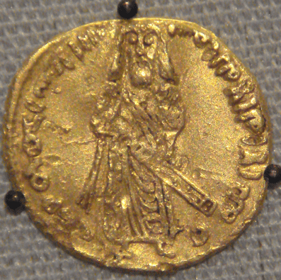 Gold dinar minted by the Umayyads in 695, which likely depicts Abd al-Malik